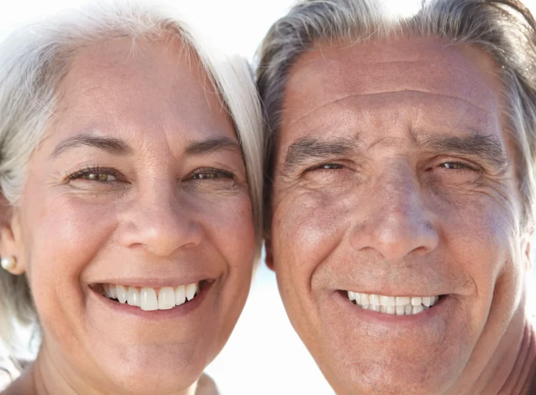 Couple showing restored smiles