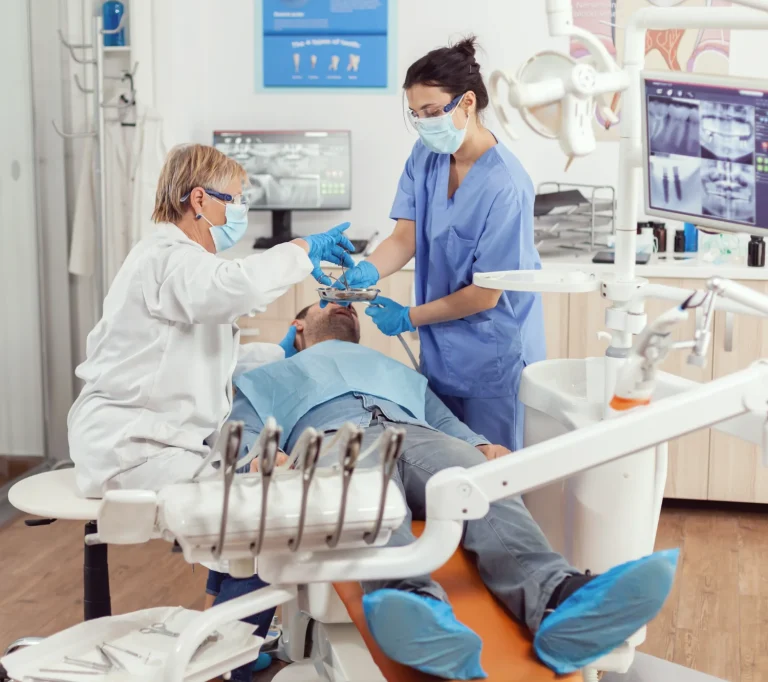 Dentist performing oral examination