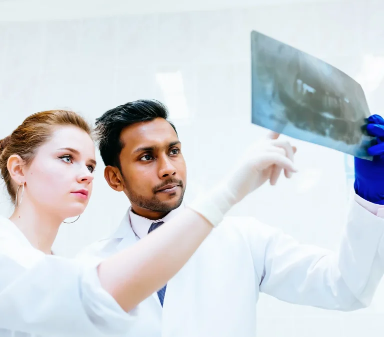 Dentist viewing X-ray results
