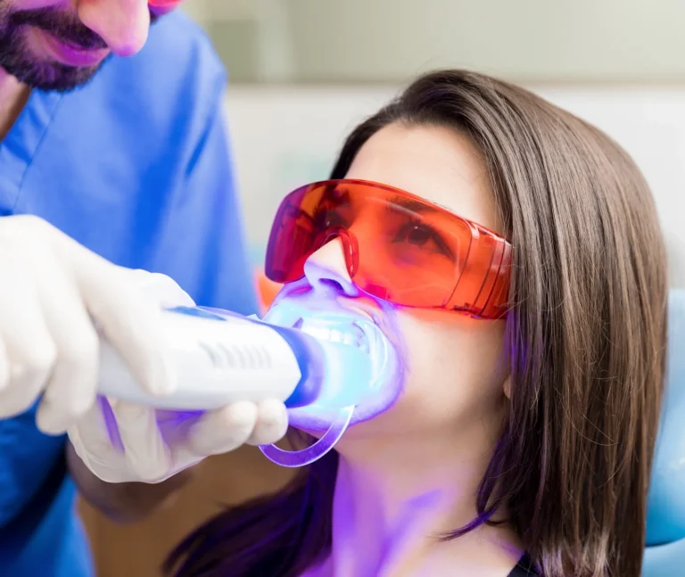 Dentist applying fluoride treatment