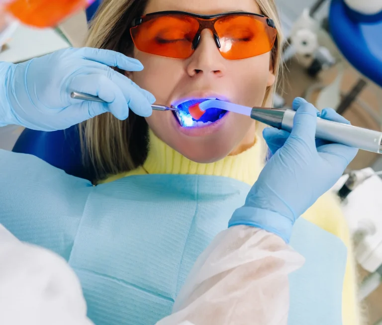 Dentist performing bonding treatment
